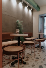 A cozy corner in a boutique hotel lobby with a QR code stand for experiences.