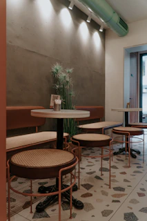 A customer scanning a QR code on a restaurant table with a warm, inviting atmosphere