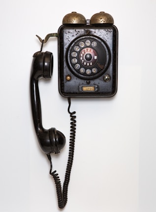 black and gray corded telephone