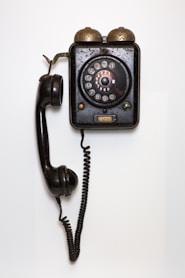black and gray corded telephone