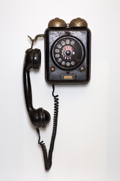 black and gray corded telephone