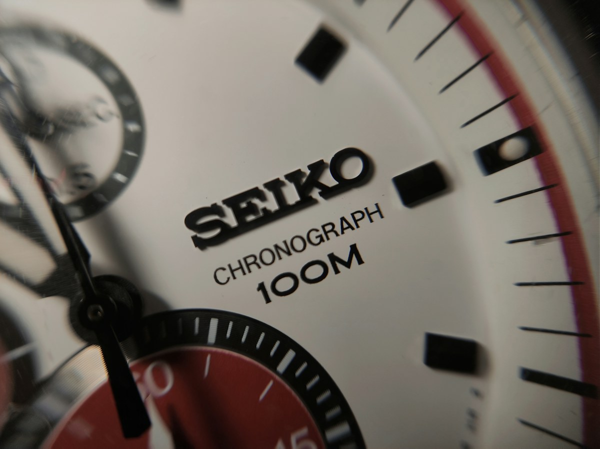 An analog watch close-up used to illustrate dial readability and case design.