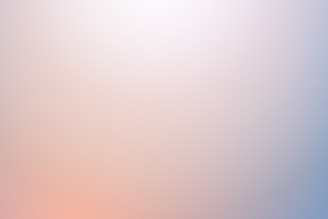 A gradient pattern with soft transitions between pastel colors, including shades of blue, pink, and orange, creating a soothing and minimalistic appearance.