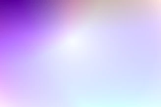 A soft gradient background blending lilac, blue, and platinum hues with fluffy texture accents.