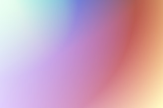 A soft gradient blending of colors, including blue, purple, peach, and light green, creating a smooth and calming visual effect.
