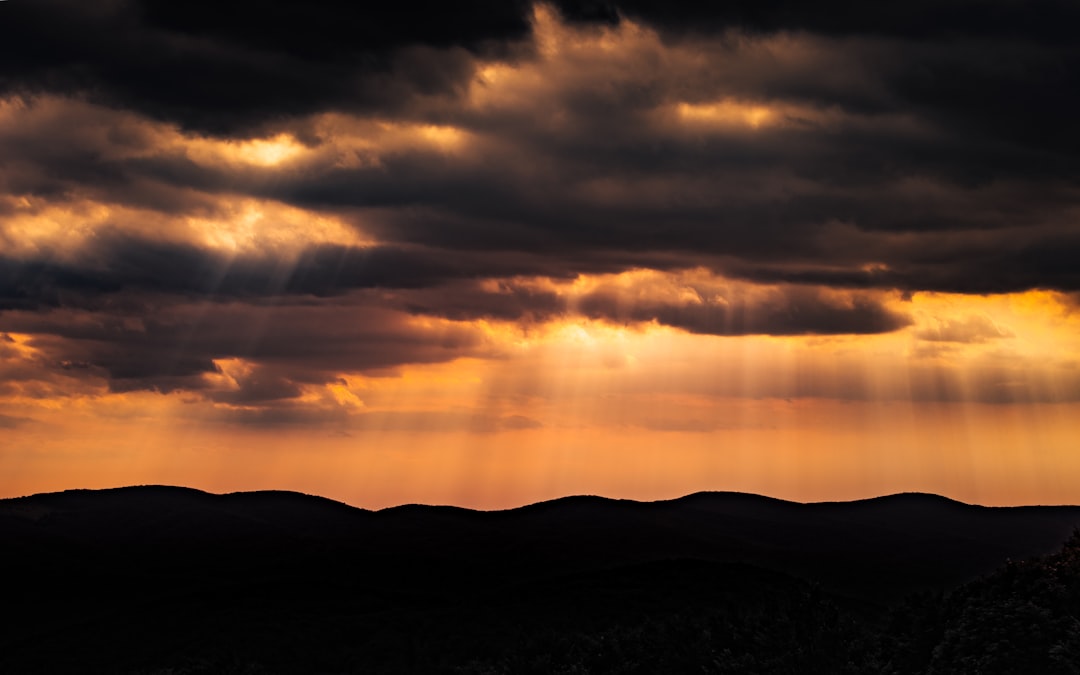 silhouette of mountain during sunset