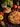 pizza with cheese and tomatoes on brown wooden round plate