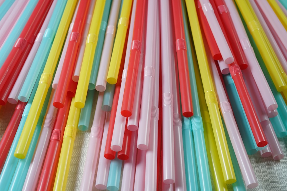 pink green and yellow plastic straw lot