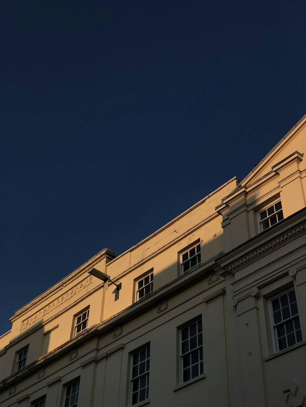 yellow concrete building under blue sky during daytime