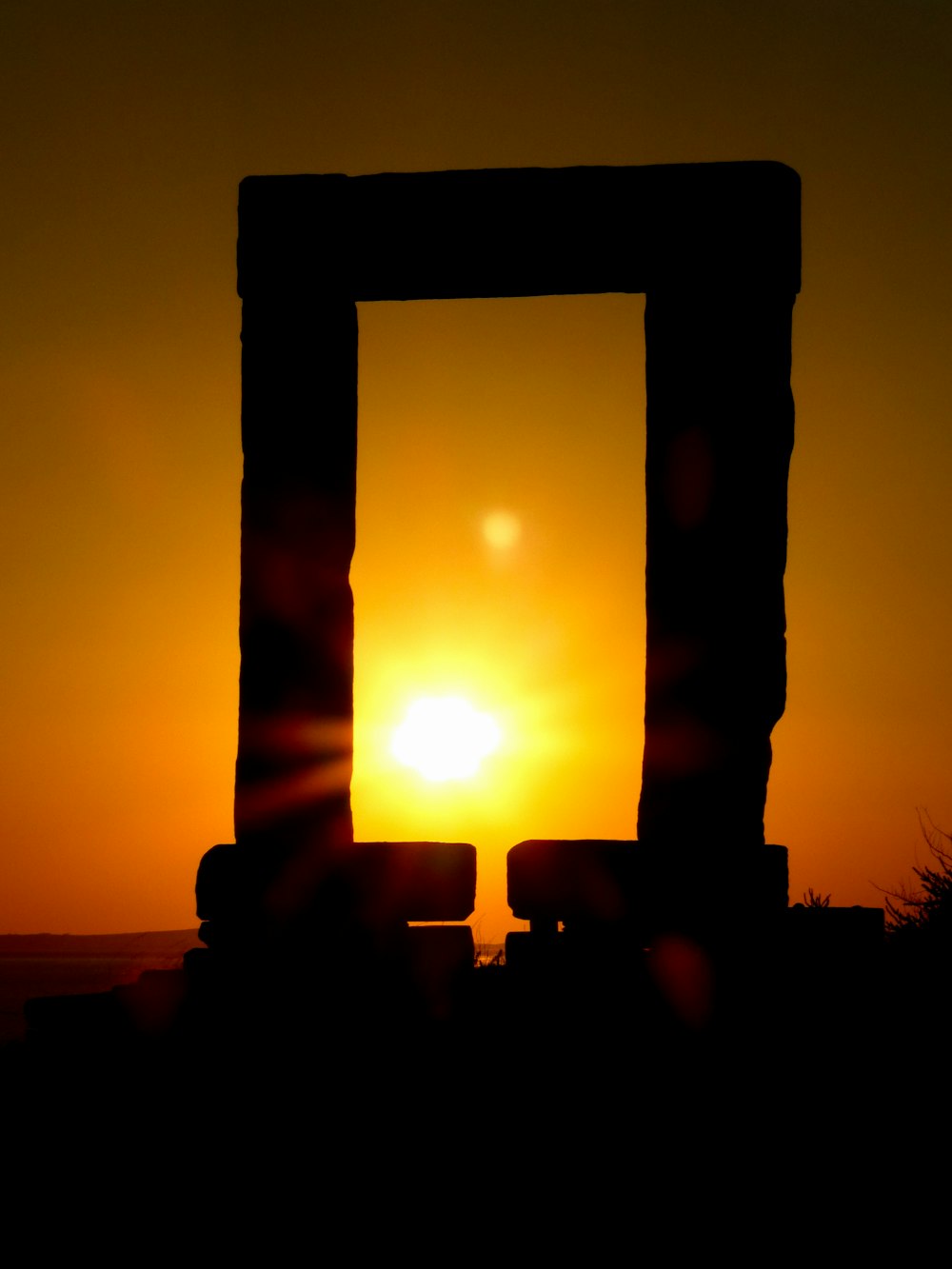 silhouette of cross during sunset