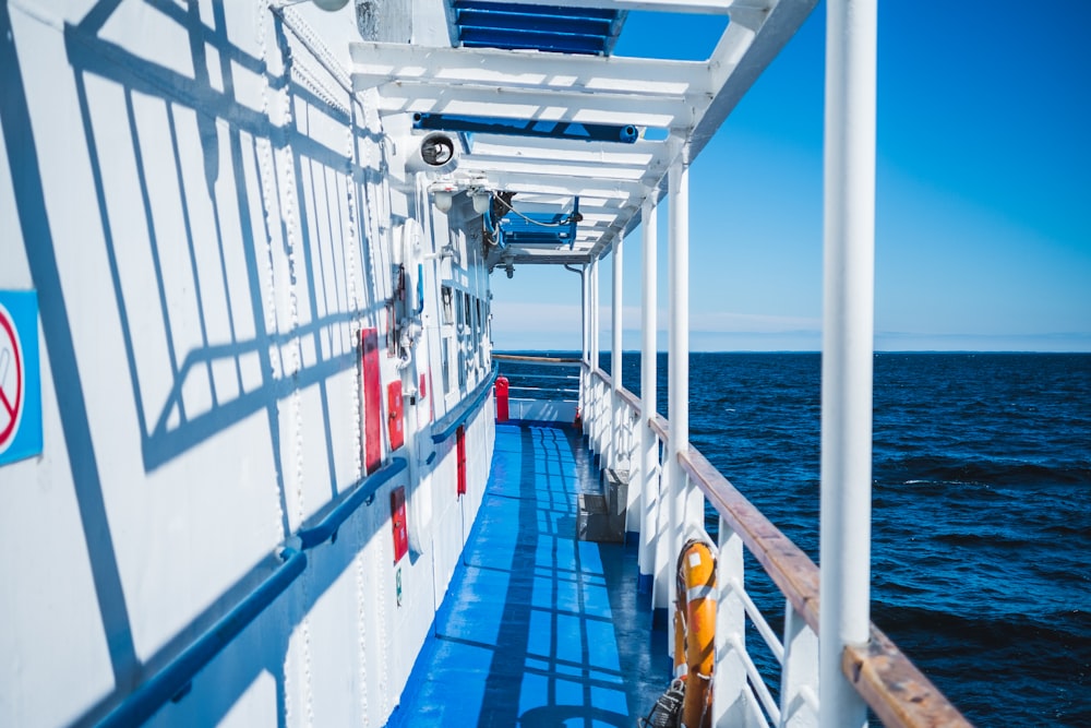 white and red ship on sea during daytime