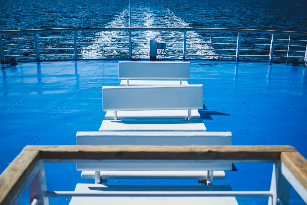 white and brown boat on blue body of water during daytime