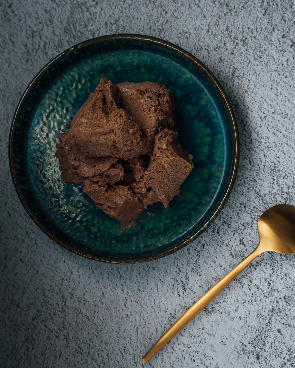 brown food on blue round plate