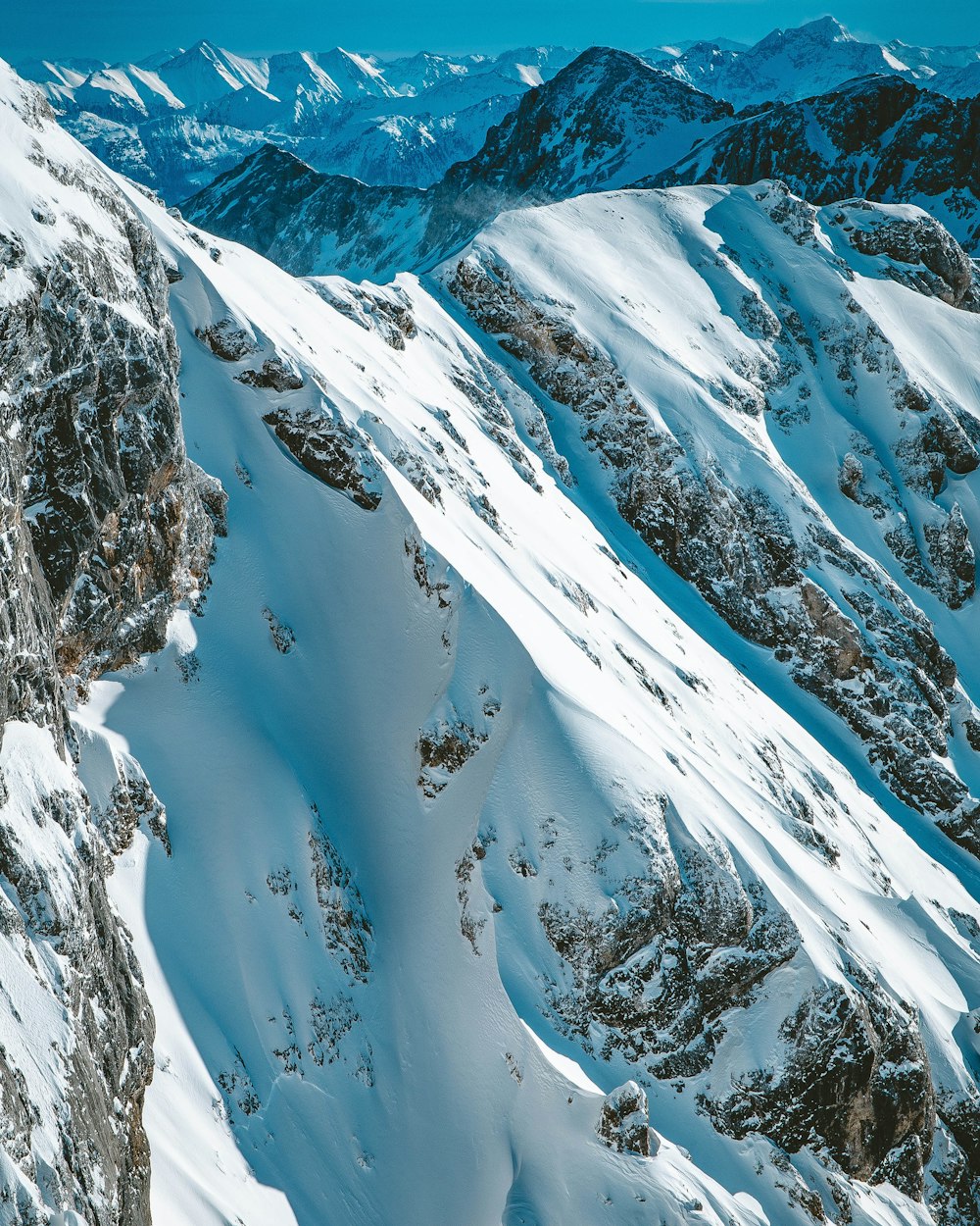 snow covered mountain during daytime