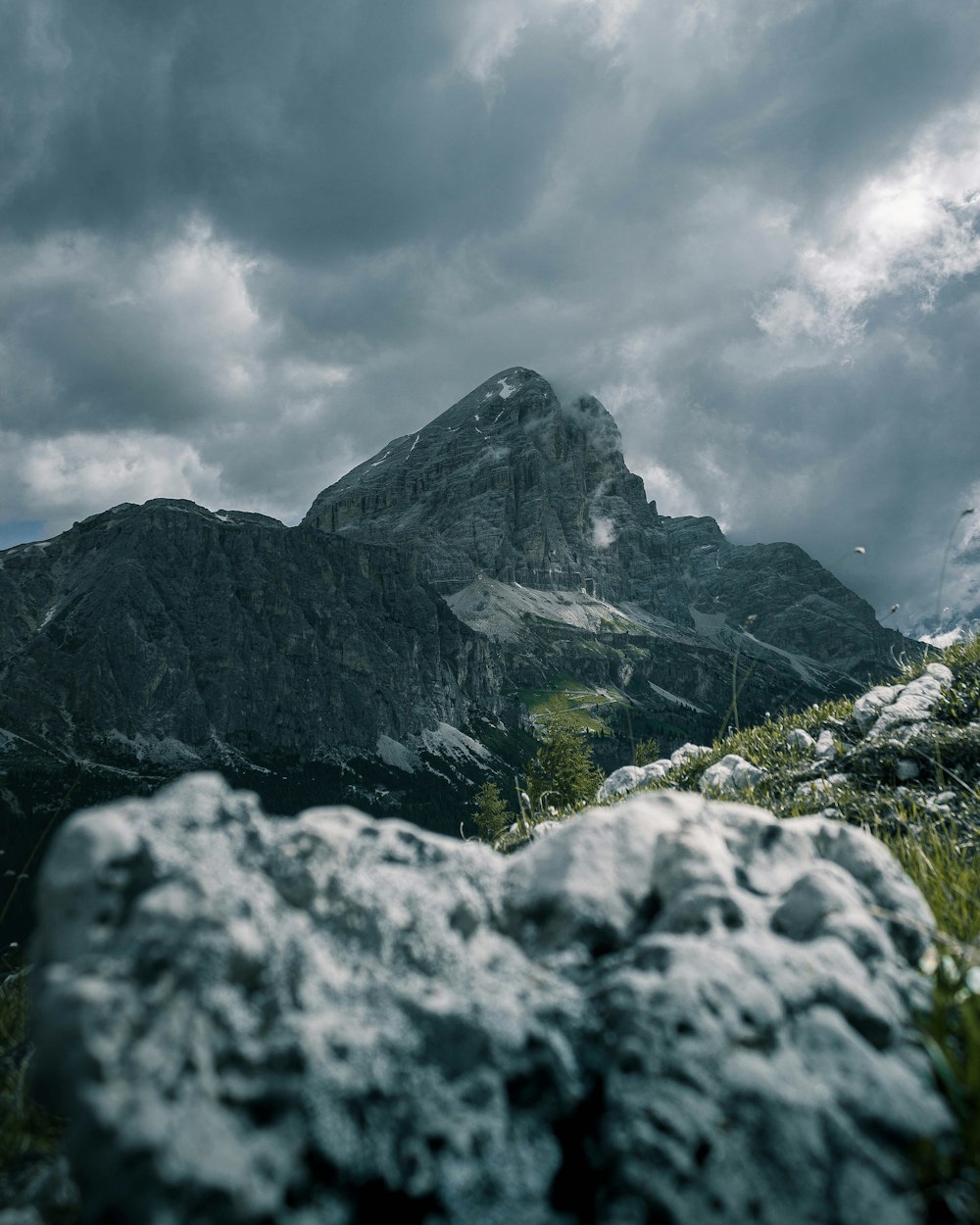 gray rocky mountain under white cloudy sky during daytime