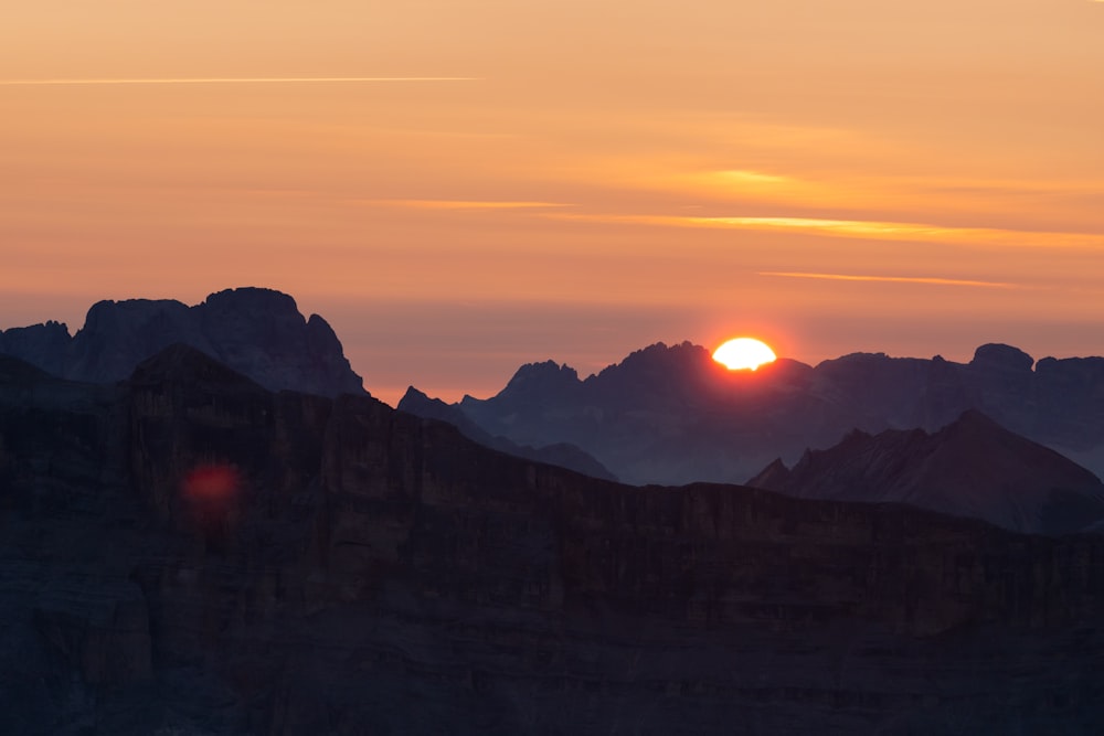 silhouette of mountains during sunset