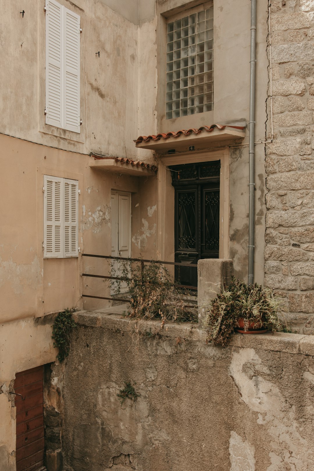 brown wooden door on beige concrete building