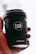 A hand is holding a black coffee cup with the logo 'CAFÉ LUX*' prominently displayed. The cup also features the text 'Ethically Sourced, Locally Roasted' and the website 'CAFELUX.MU'. The background is softly blurred, emphasizing the cup.