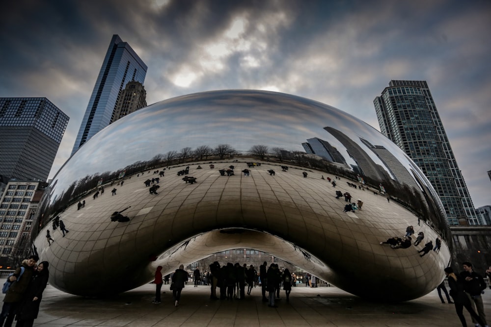 people walking near cloud gate during daytime