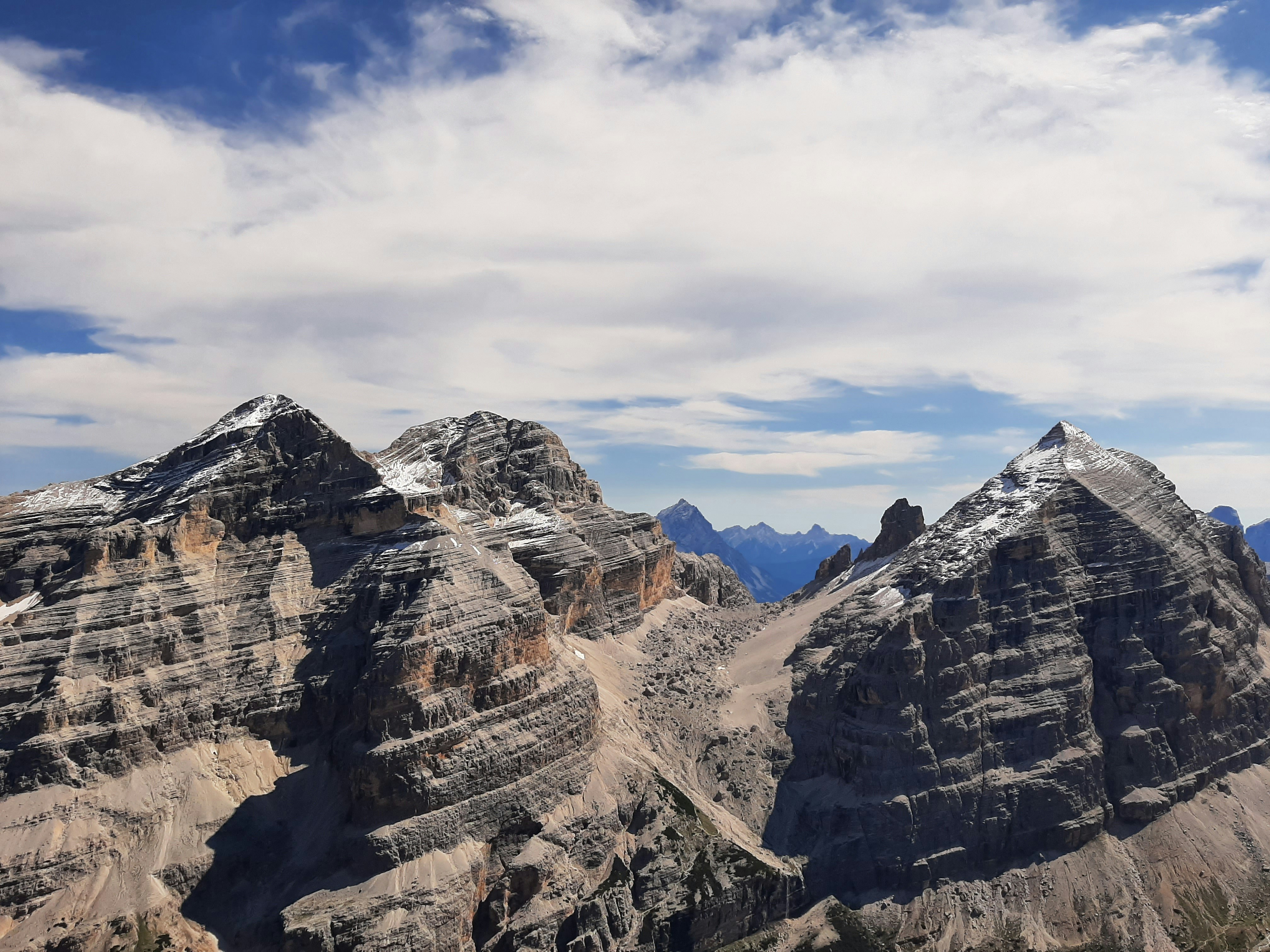 brown rocky mountain under blue sky during daytime