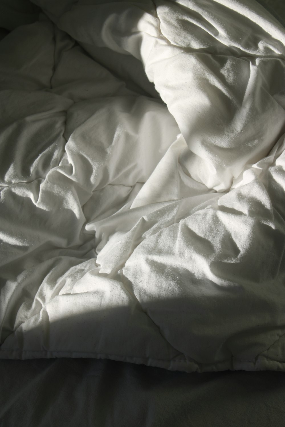 white textile on brown wooden table