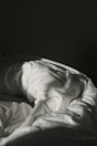 white textile on black textile