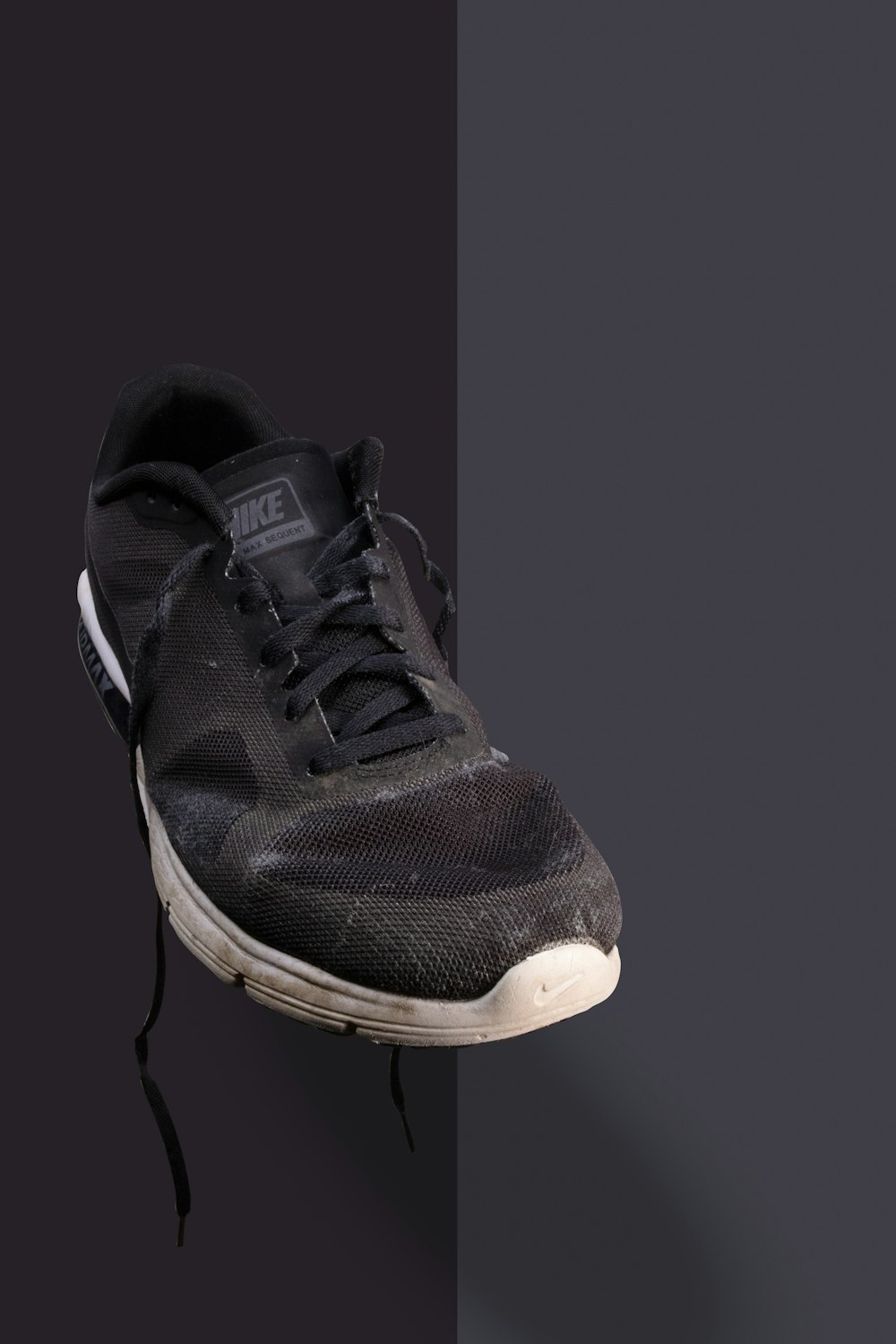 black and white nike athletic shoe