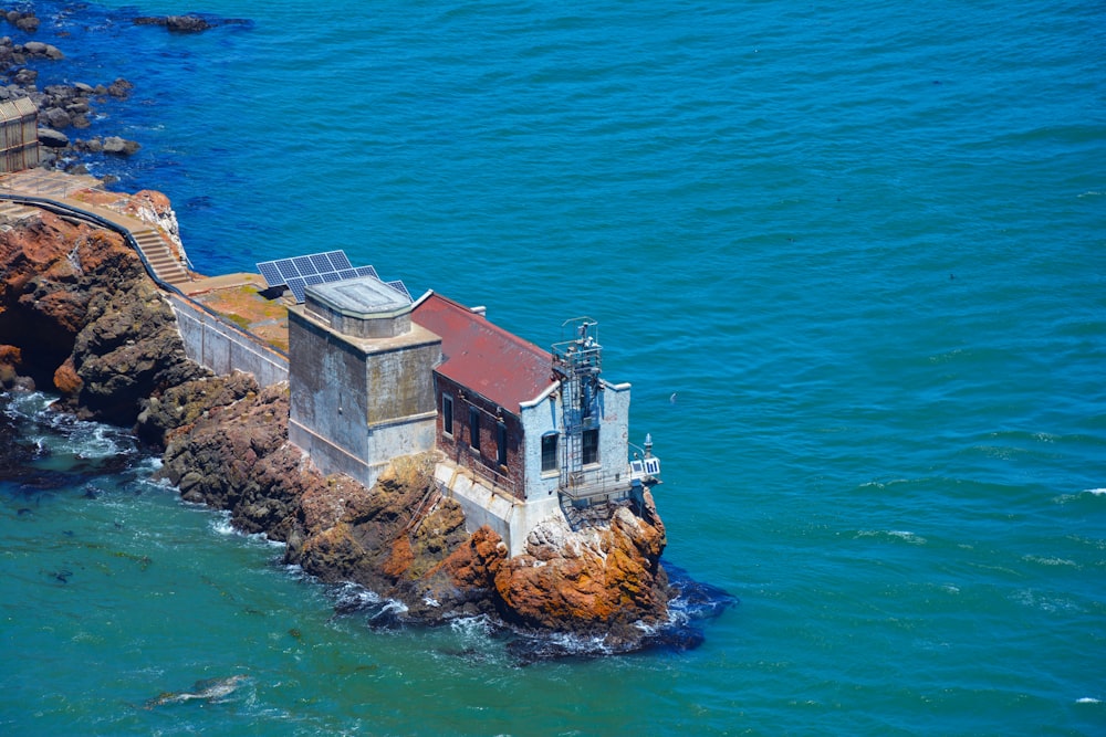 aerial view of white and brown concrete building on island during daytime