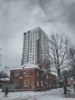 Charming senior apartment building with snow-dusted rooftops.