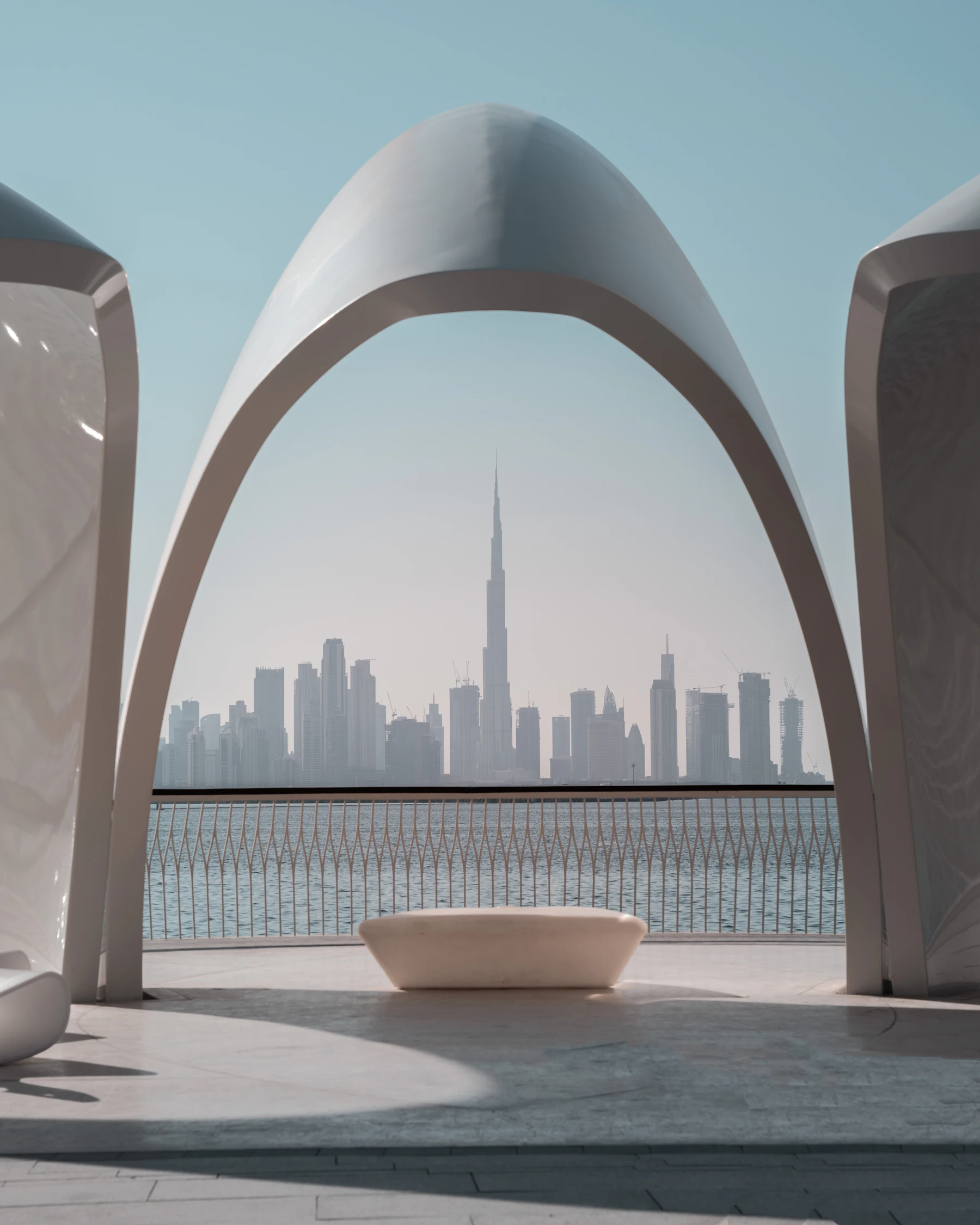 A modern white building in the UAE against a clear sky