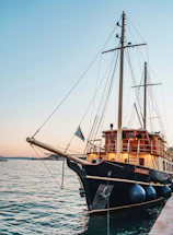 Elegant sailboat moored at sunset in the Gulf of Poets near La Spezia.