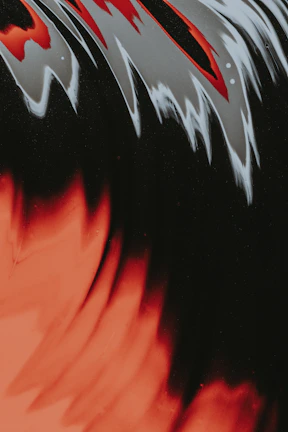 Abstract brush strokes in warm reds and oranges blending into cool blues, evoking festival energy.