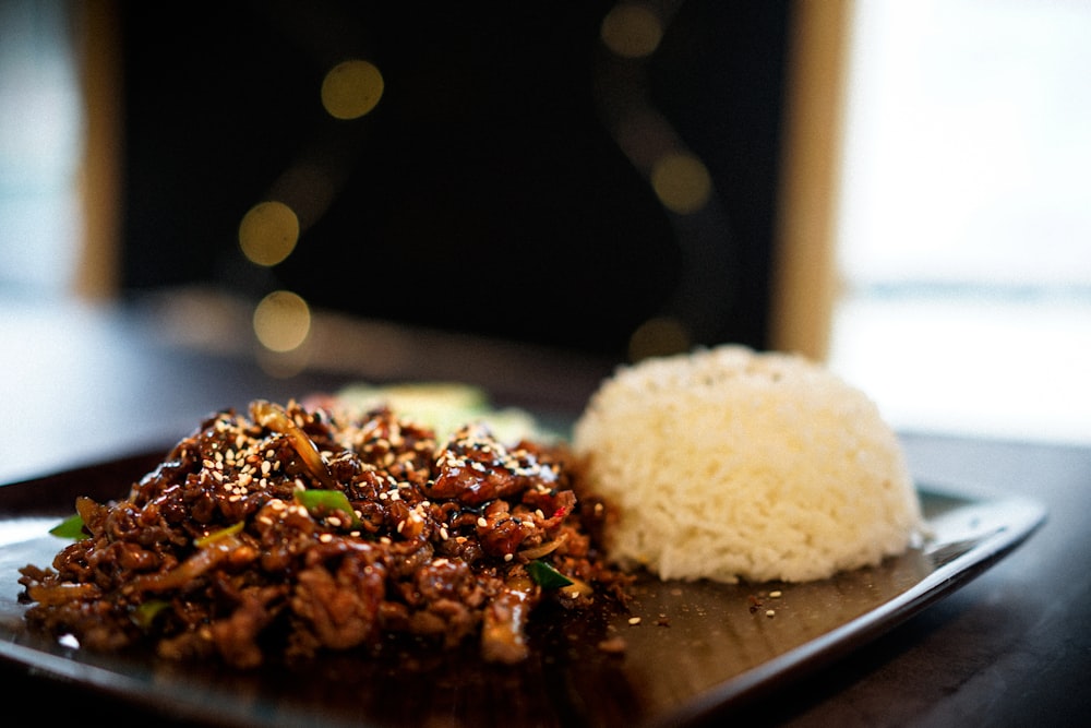 white rice on black ceramic plate