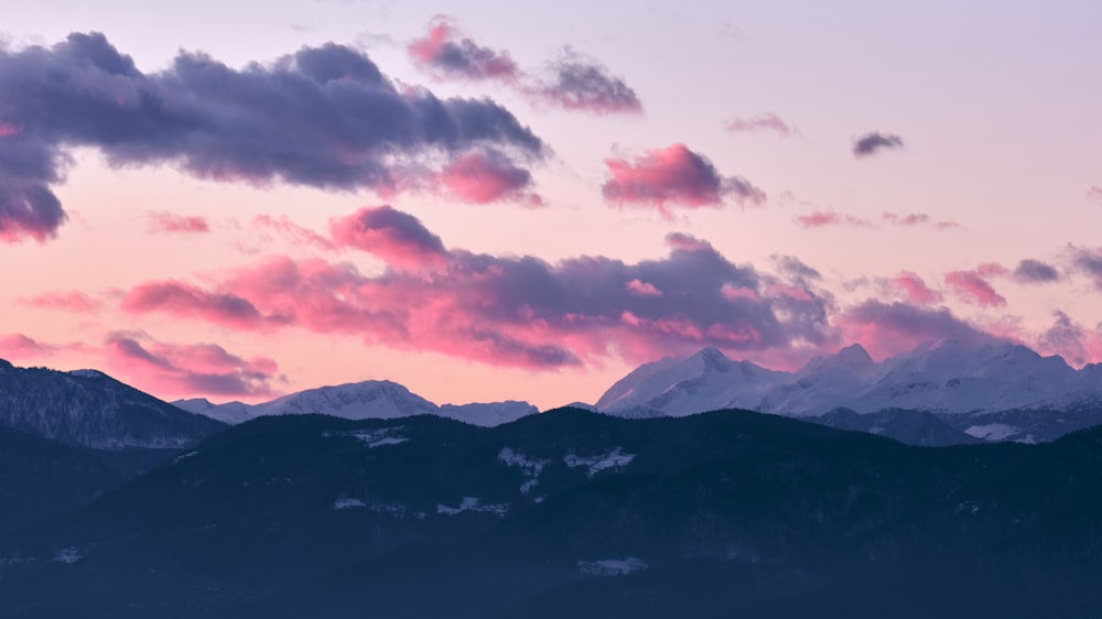 black and white mountains under white clouds