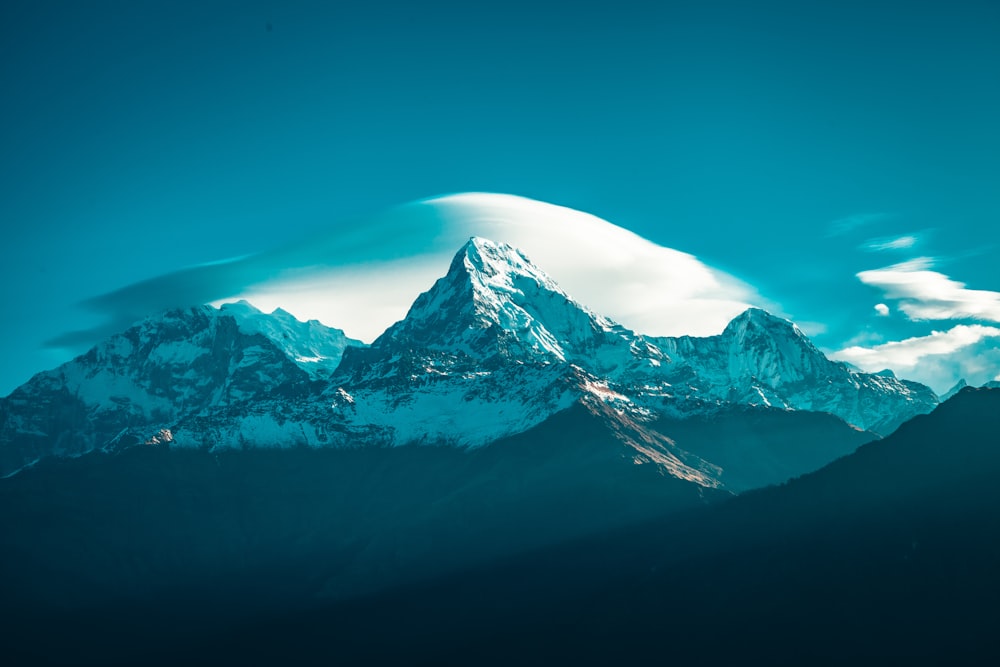 snow covered mountain under blue sky