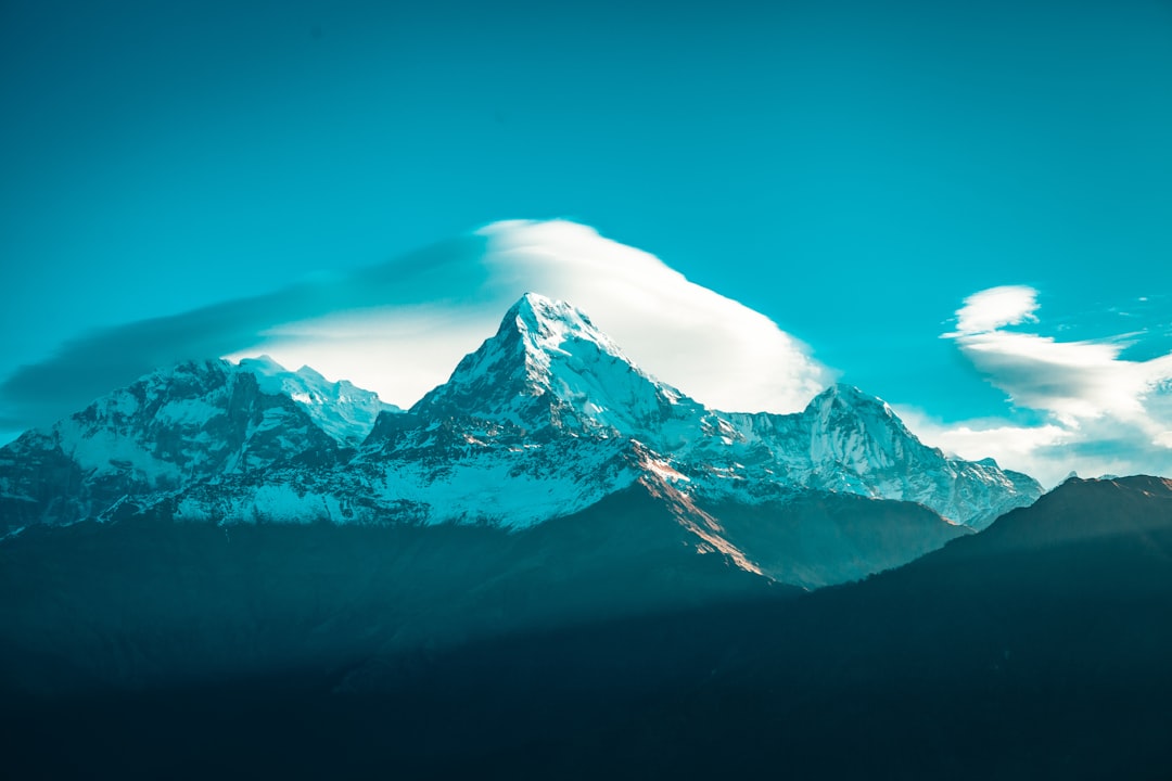 snow covered mountain under blue sky