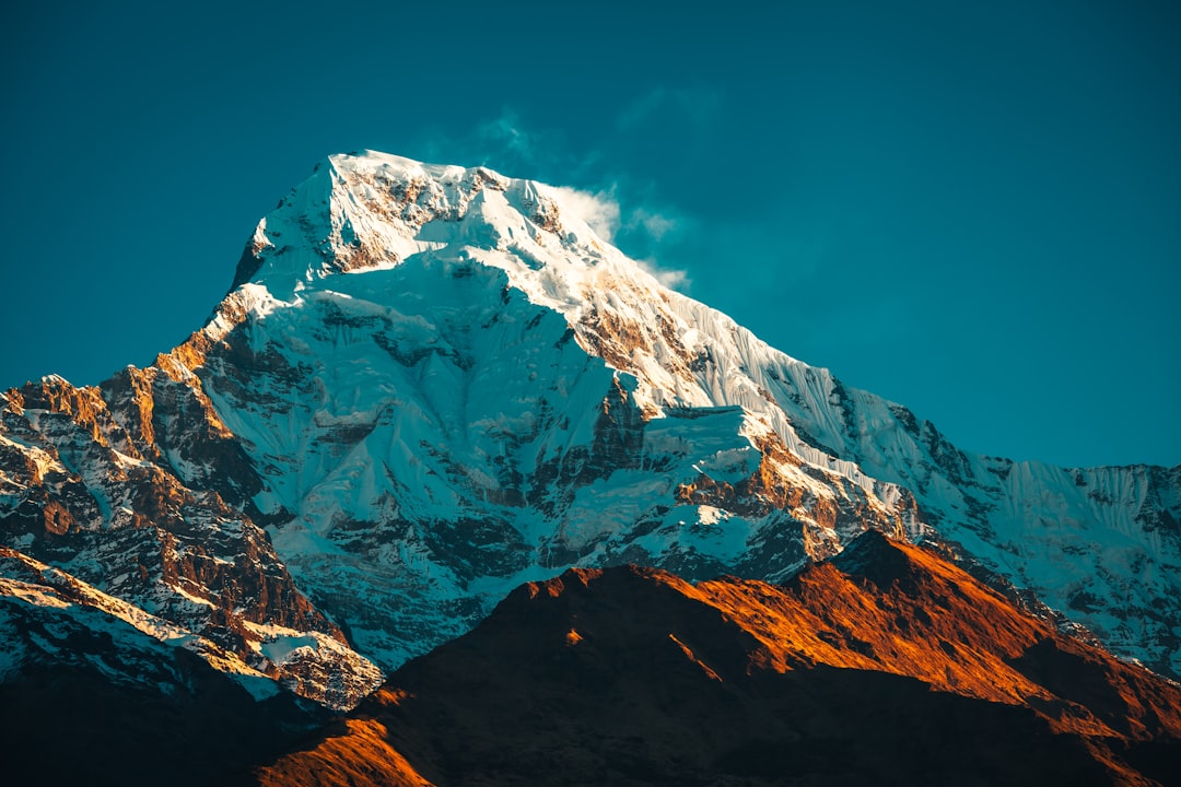 snow covered mountain under blue sky during daytime