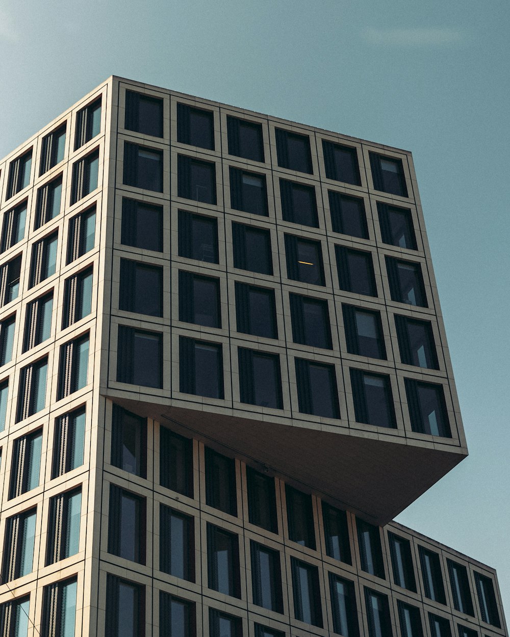 brown concrete building under blue sky during daytime