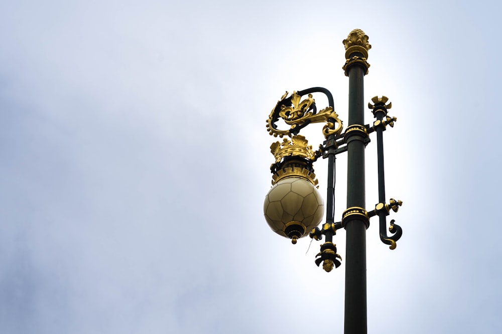 white and gold street lamp
