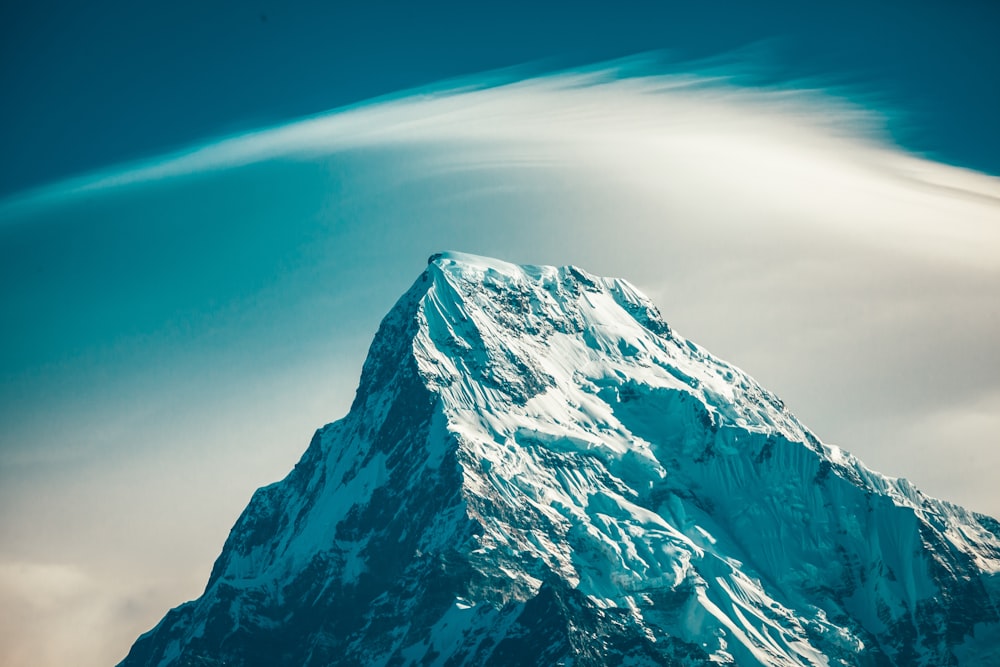 snow covered mountain under blue sky