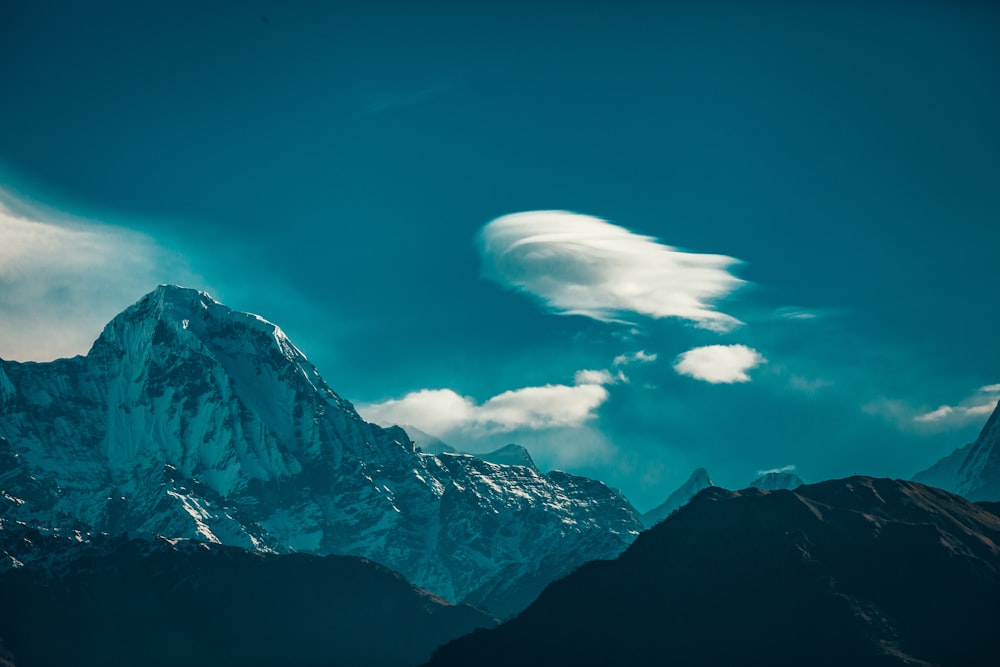 snow covered mountain under blue sky during daytime