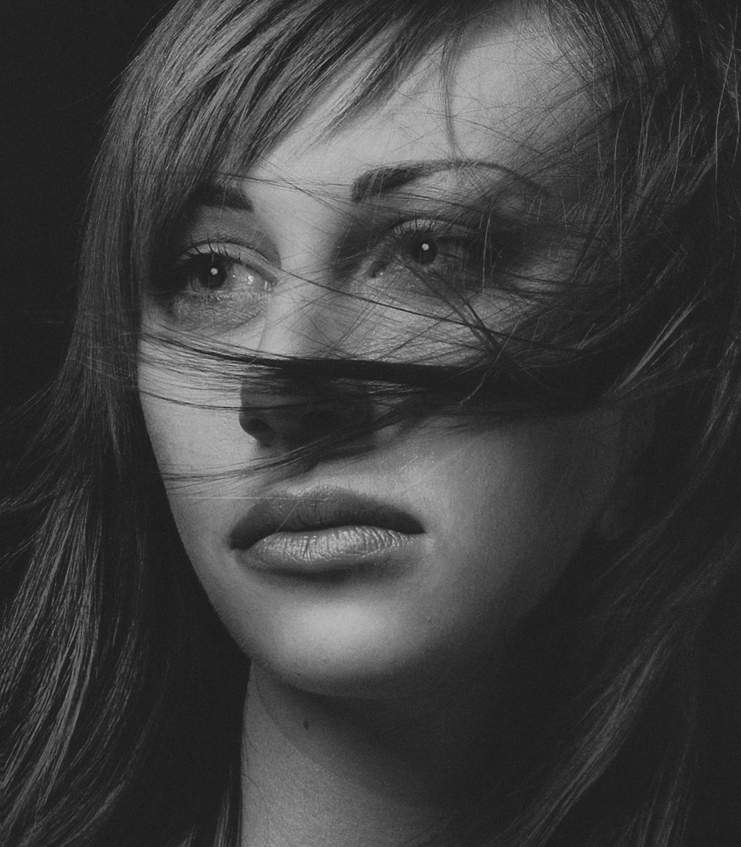 grayscale photo of womans face