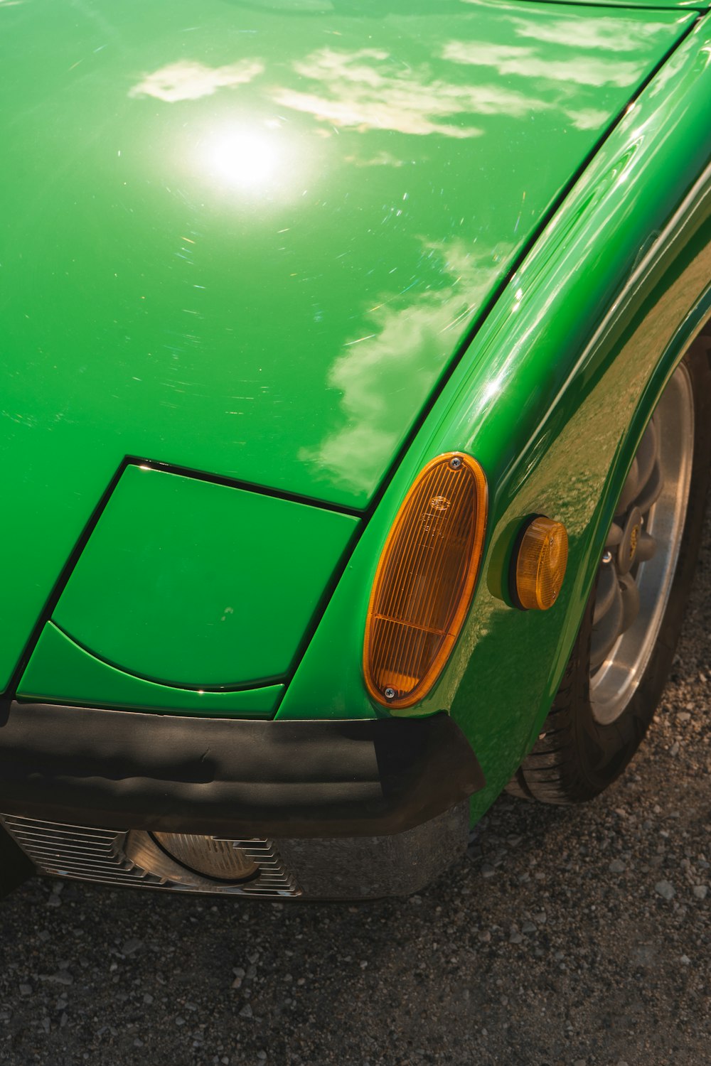 green car with brown wheel