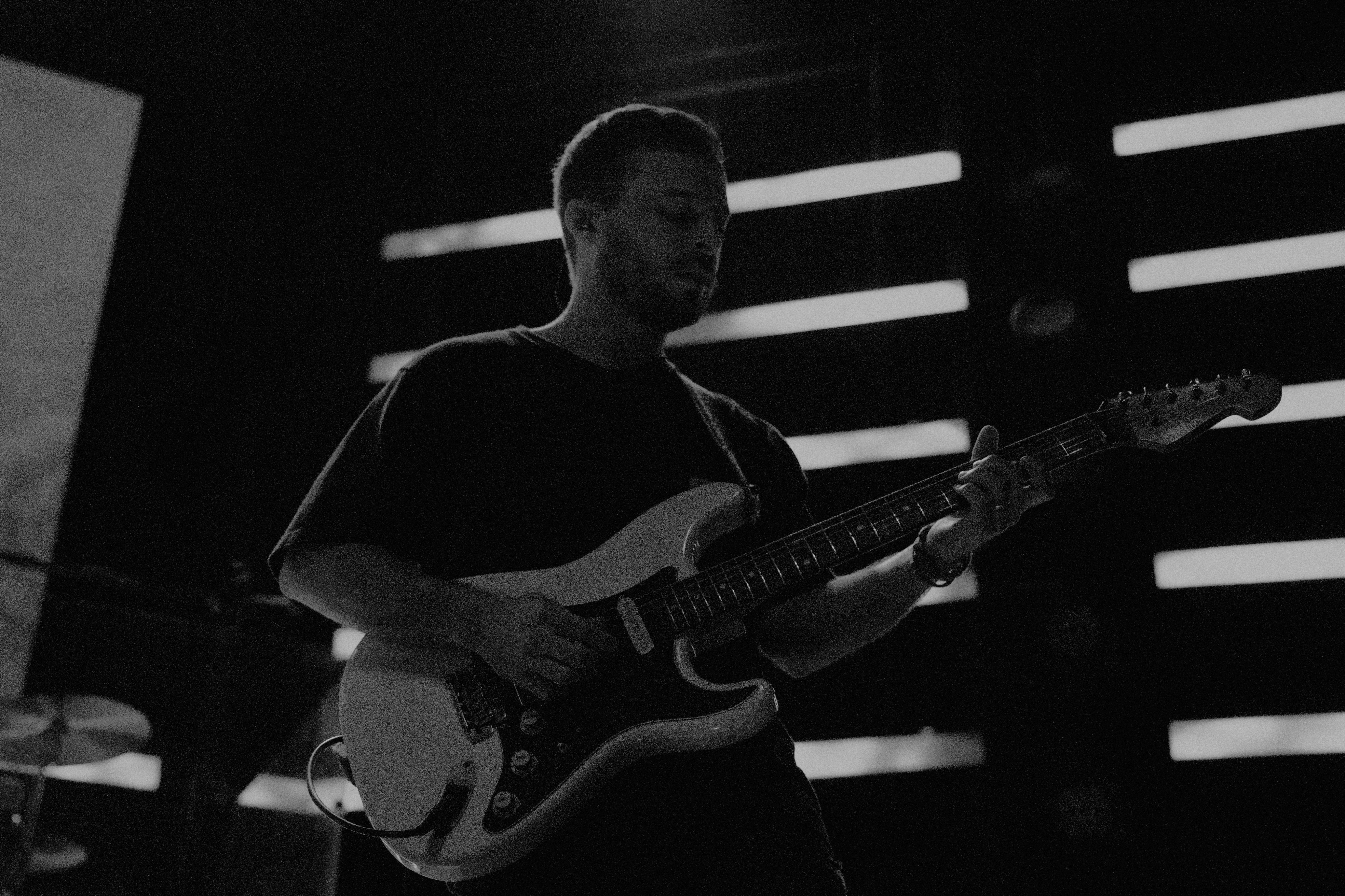 Zach Bryan with a guitar