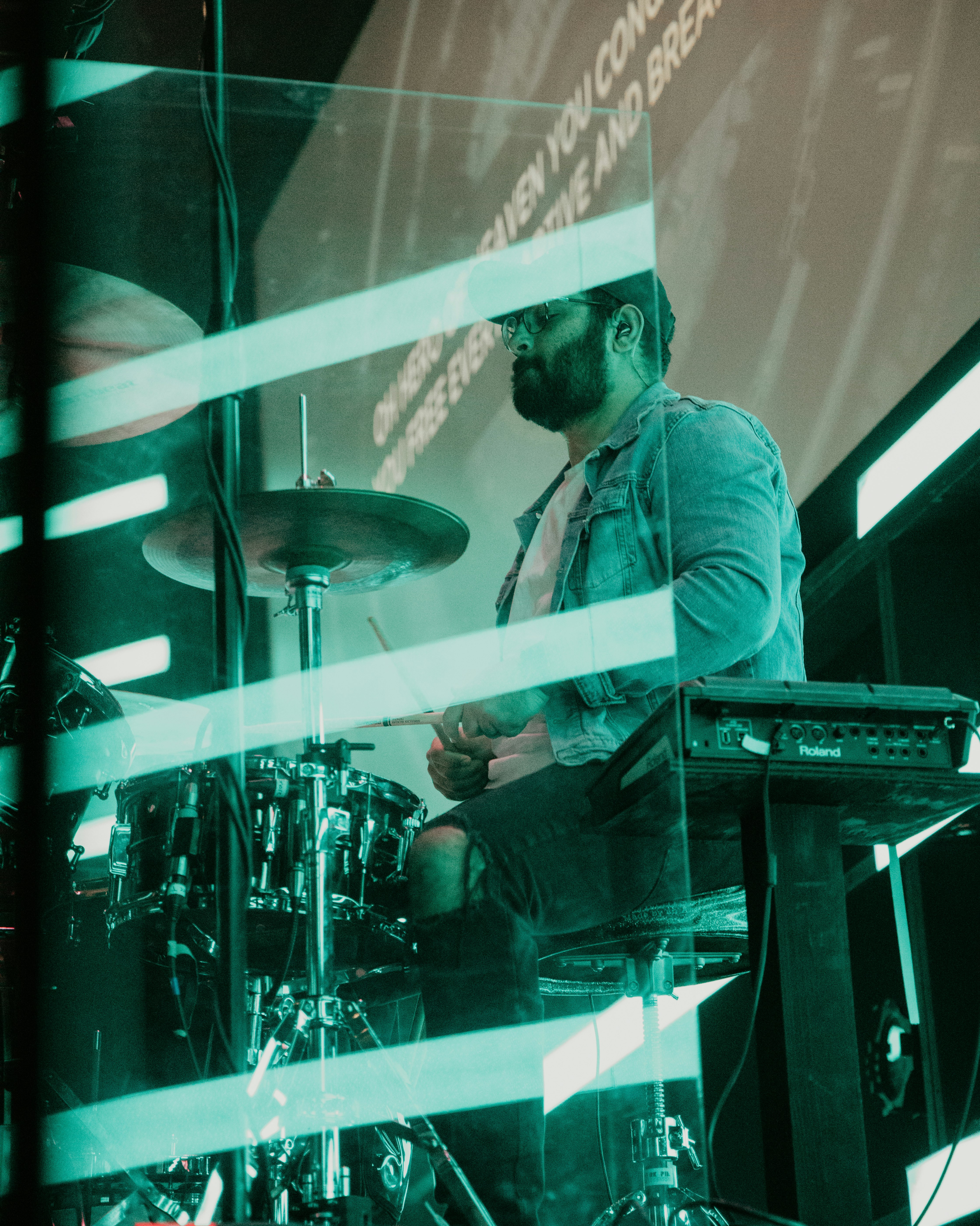 man in white dress shirt playing electric keyboard