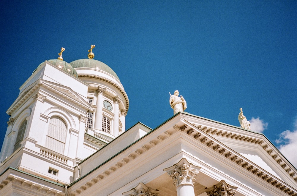 white and gold dome building under blue sky during daytime