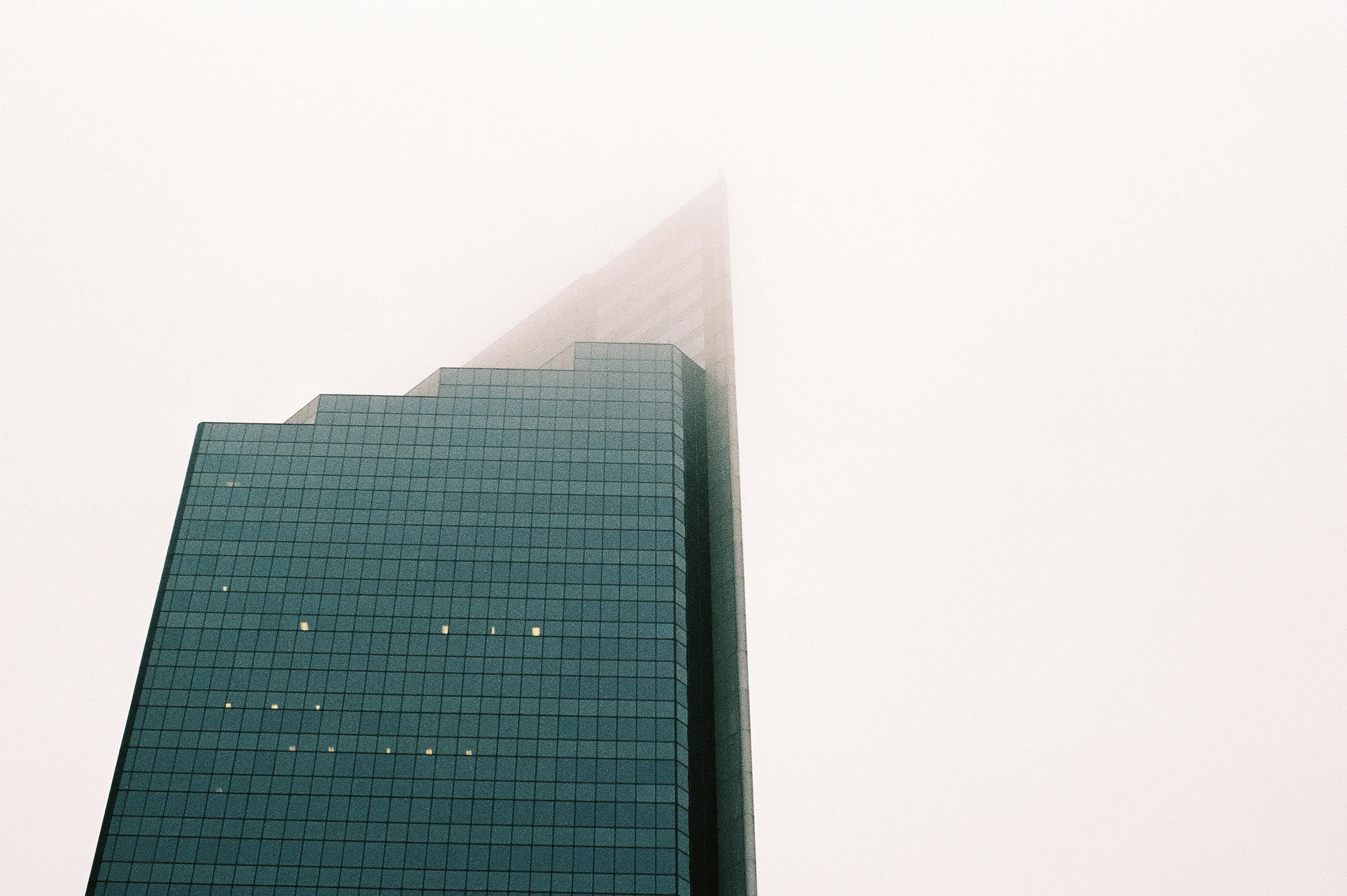 black glass walled high rise building