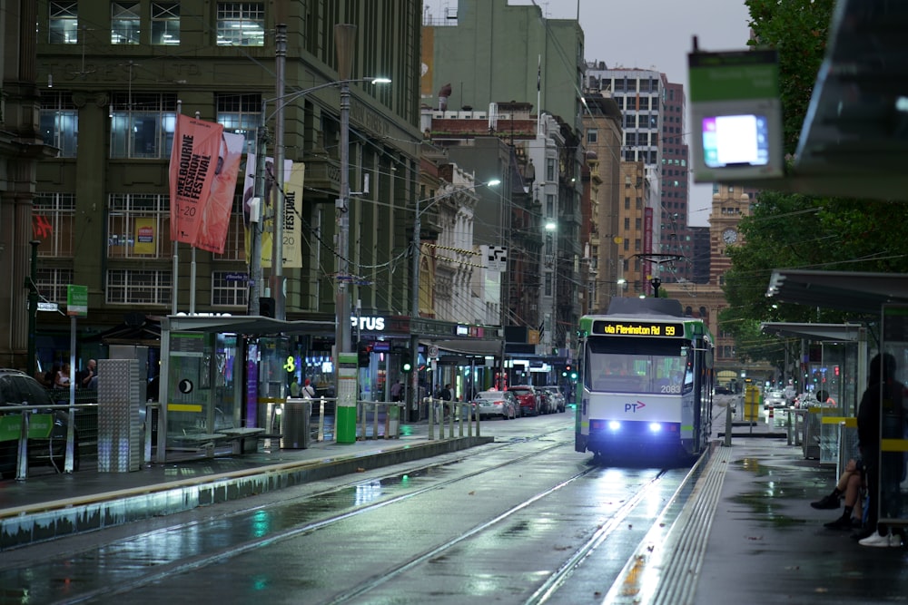 red and white tram on road during daytime