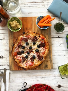 A cozy dining setting with a pizza and eco-friendly tableware.