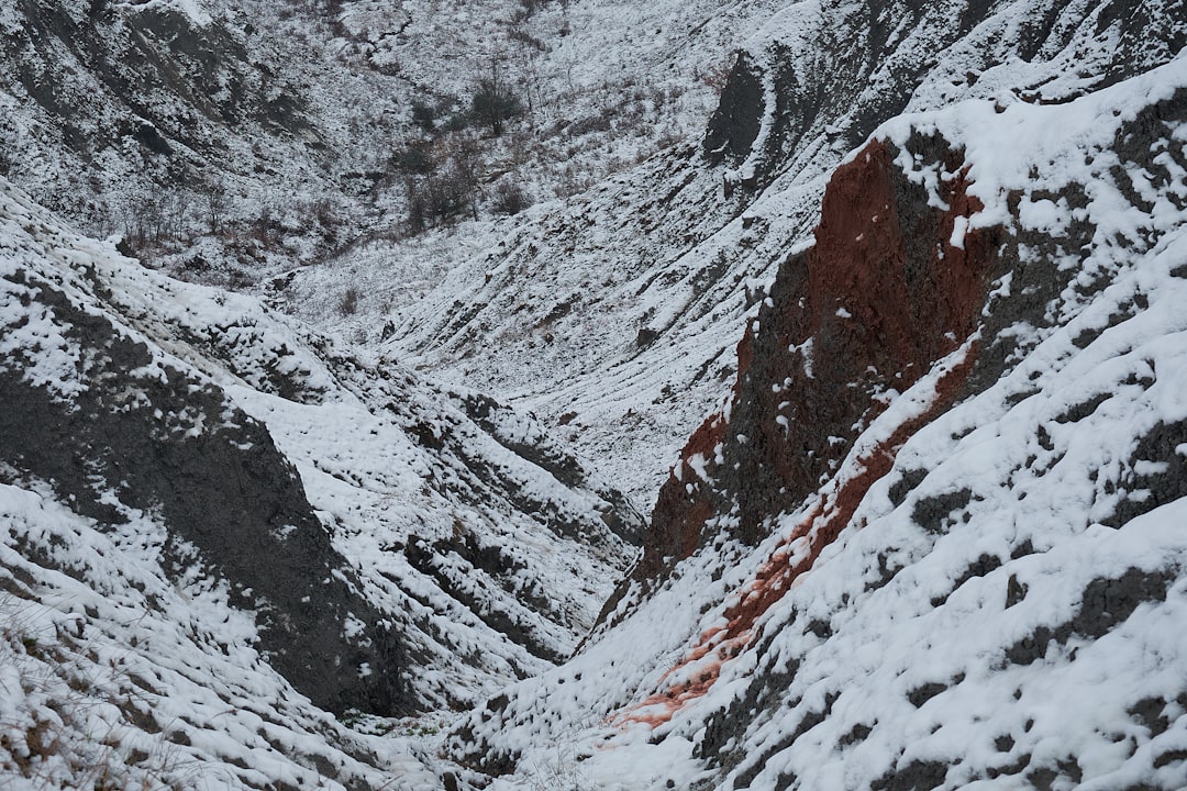 snow covered mountain during daytime